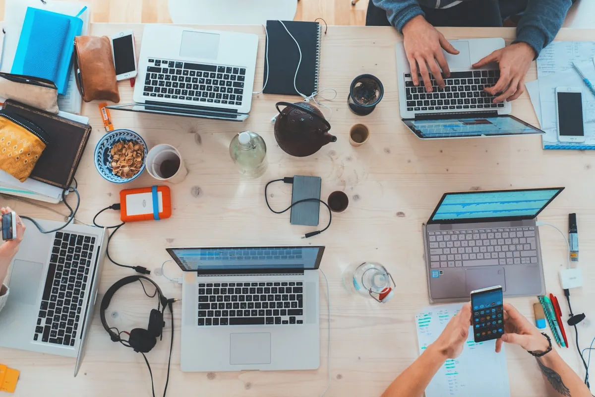 Startup founders collaborating on web design project in a modern London office workspace.