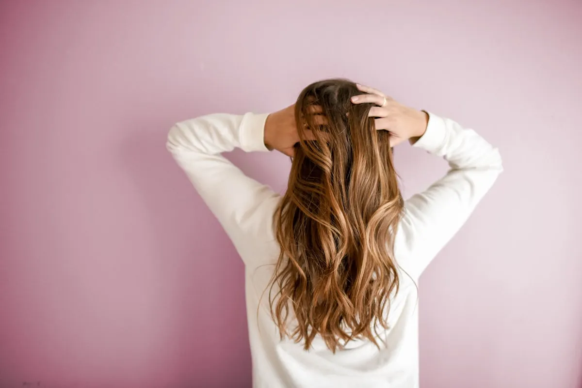 Professional hairdresser carefully cutting client hair in a stylish London salon interior