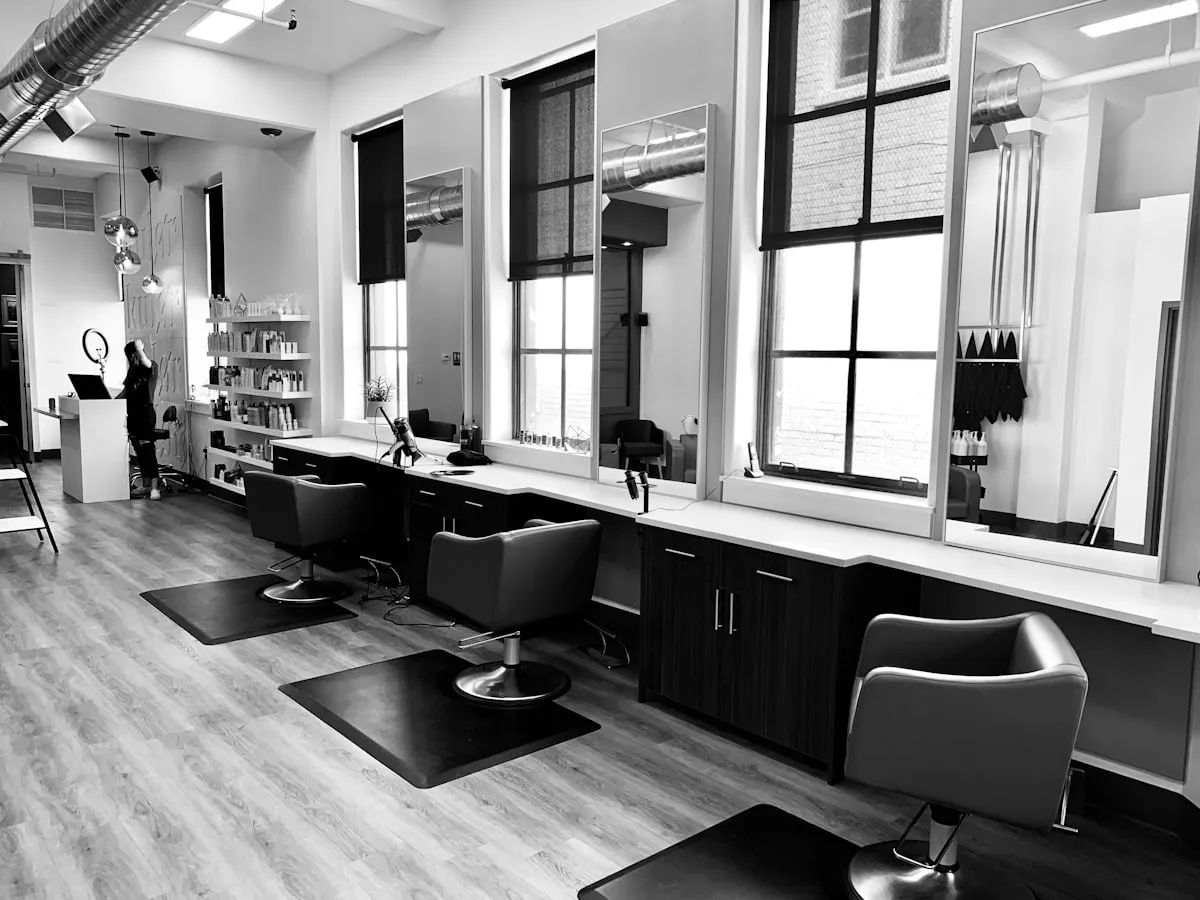 Elegant beauty salon interior with styling chairs and mirrors, London web design