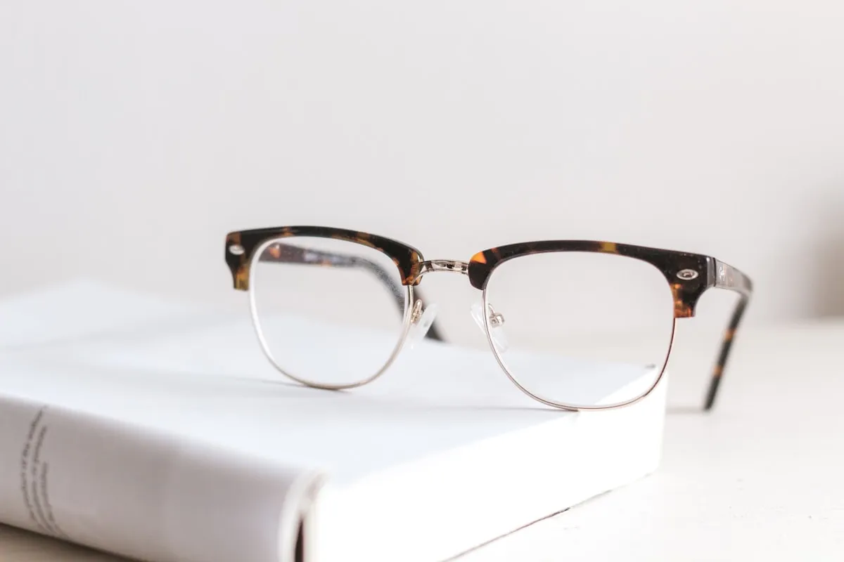 Independent optician displaying designer eyewear frames in a modern London optical practice